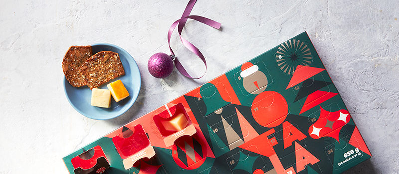 Quebec artisanal cheese Advent calendar on table with purple napkin by its side.
