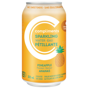 Clear plastic bottle of Compliments Pineapple sparkling water with a label on the front.