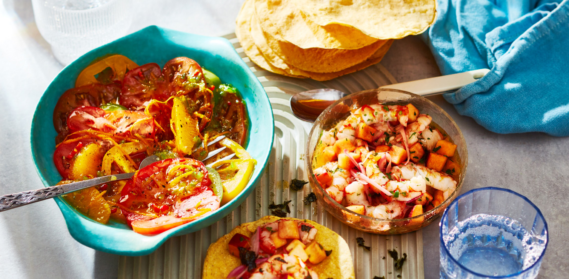 bowl of shrimp ceviche and taco shells, with side bowl of heirloom tomato ceviche