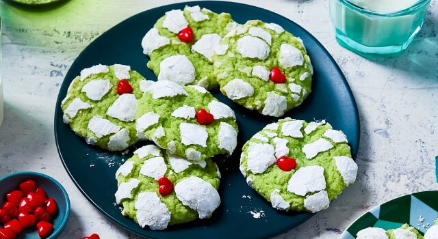 Two plates filled with earthquake cookies and two glasses of milk with festive straws